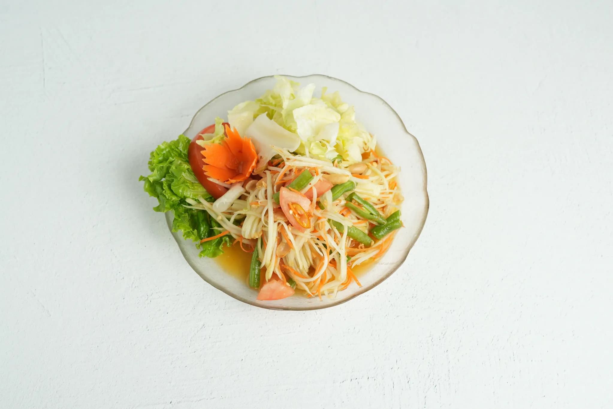 Papaya Salad (spicy upon request) plated at Maly Thai restaurant in St. Charles